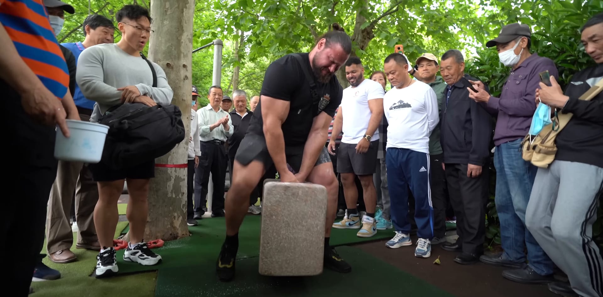 Martins Licis carries the huge stone lock.