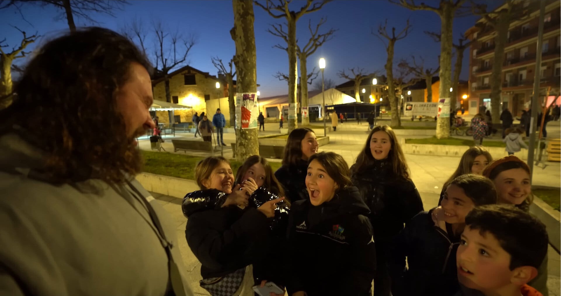 Martin Licis talks to excited children about Basque Stonelifting