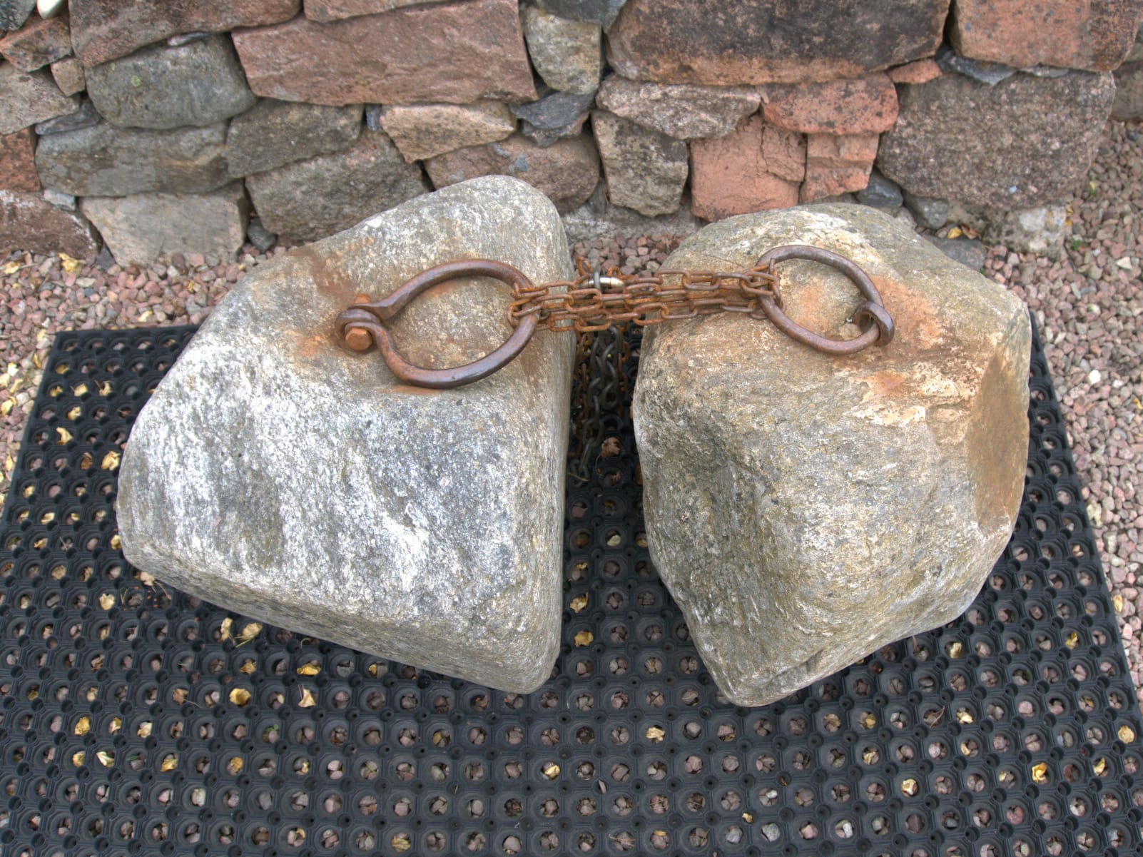 The Dinnie Stones chained together at Potarch. The rings on the stones are clearly different.