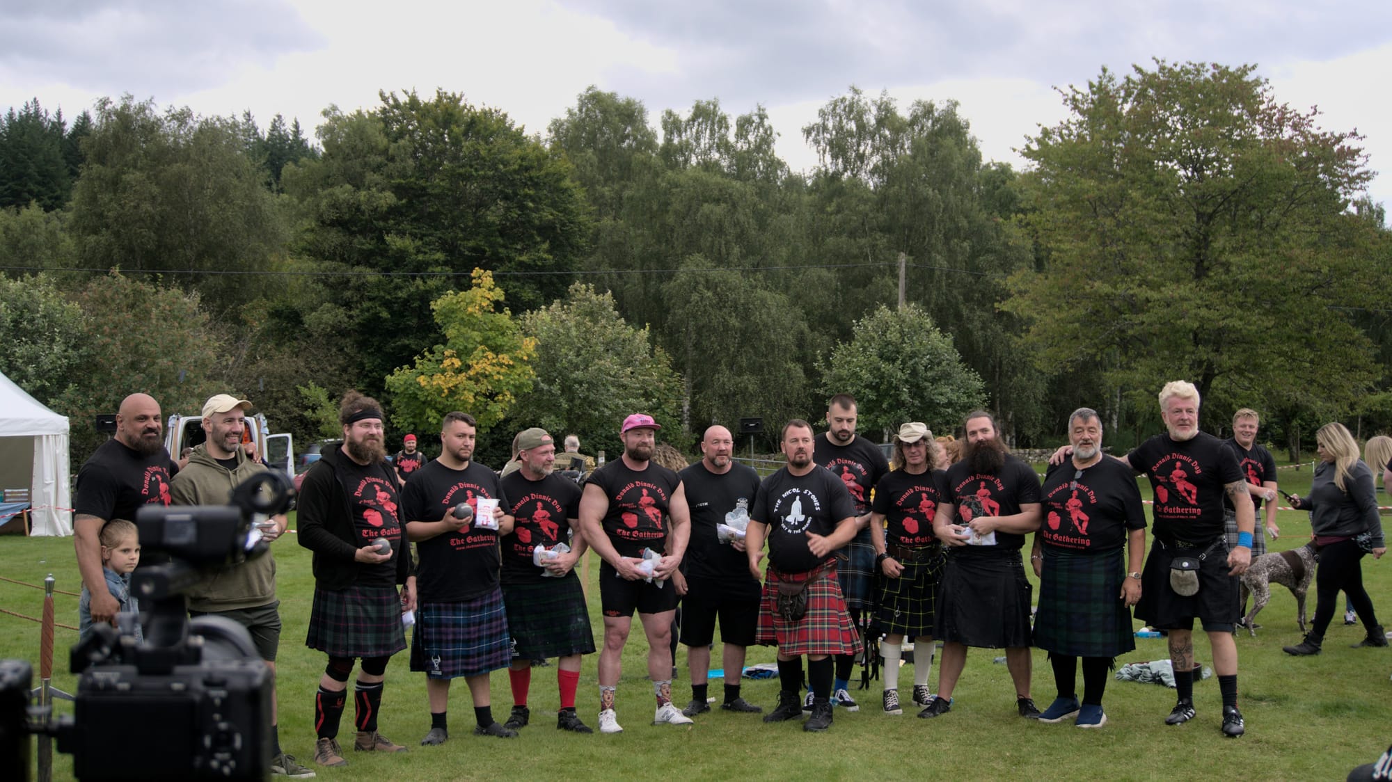 A group of men pose with their awards for a photo.