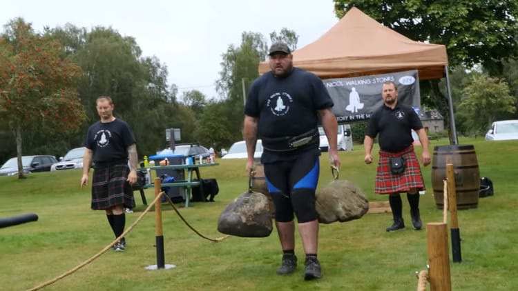 Andy Black carries the Nicol Walking stones in Potarch