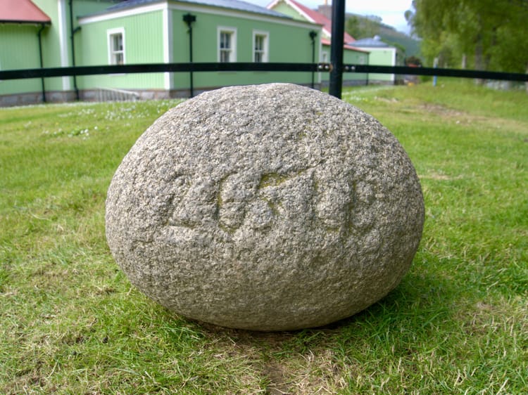 The iconic Inver Stone sitting on grass.