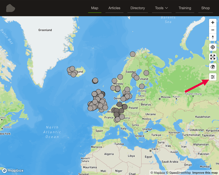 A screenshot of the liftingstones.org map with a red arrow pointing towards the new slider button for filtering